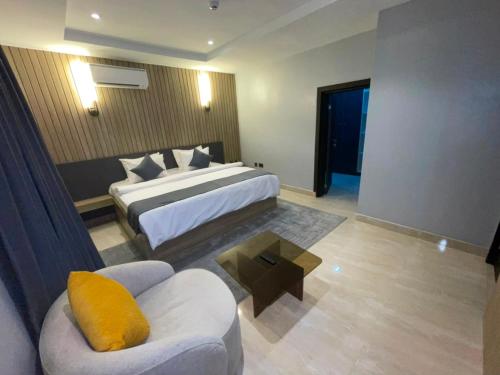 a hotel room with a bed and a couch at IP Hotels And Towers in Chori