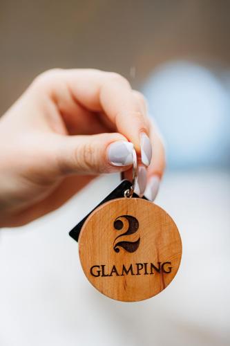 a person holding a tag with the number two on it at Dream Park in Gyulagarak