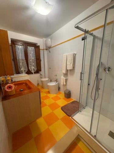 a bathroom with a shower and a sink and a toilet at B&b Al Castello in Gerace