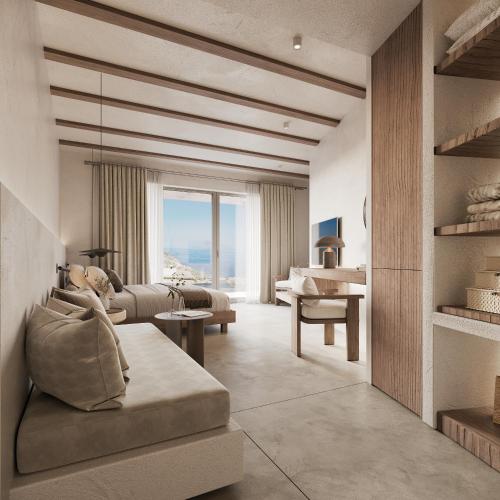 a living room with a couch and a table at Geomilos Private Suites Milos in Triovasálos