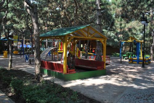 a playground in a park with a play structure at Kompleks Otdykha Elki-Palki in Odesa