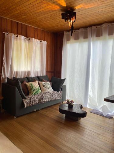 a living room with a couch and a table at Cabana in Annitapolis