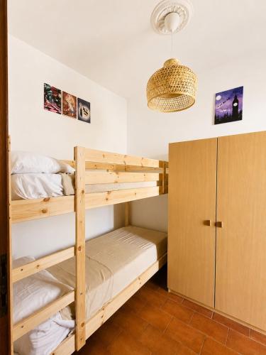 a bunk bed room with two bunk beds at Kronos House in Torre del Lago Puccini