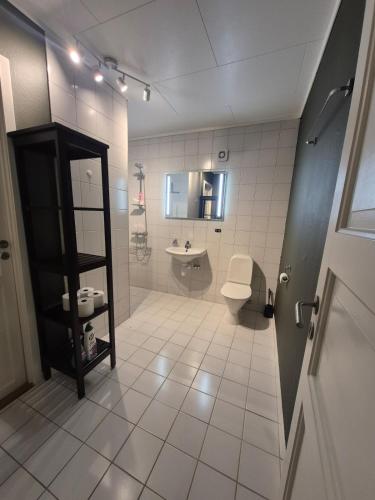 a bathroom with a toilet and a sink at Villa Strand in Skodje