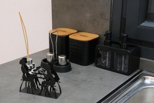 a kitchen counter with a stove with two stoves at VenisHome 2 in Chrysoupolis
