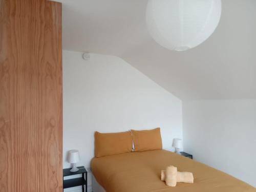 a bedroom with a bed with two towels on it at Comfy Home in Castlebar
