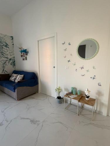 a room with a bed and a mirror and a table at Angels Venice in Marghera