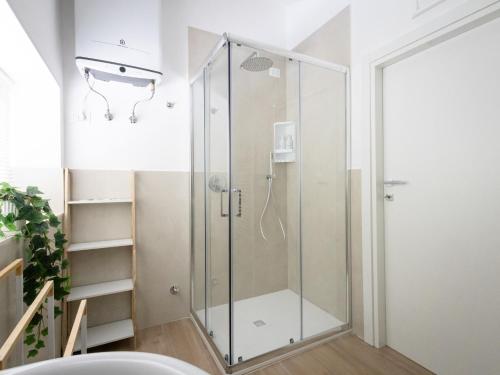 a shower with a glass door in a bathroom at Le camere di Gaudré in Battipaglia