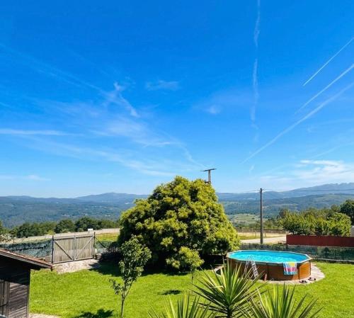 a house with a swimming pool in a yard at A Casa do Ferreiro in Cerdedo