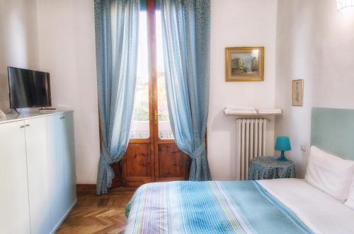 Postel nebo postele na pokoji v ubytování Villa Gini