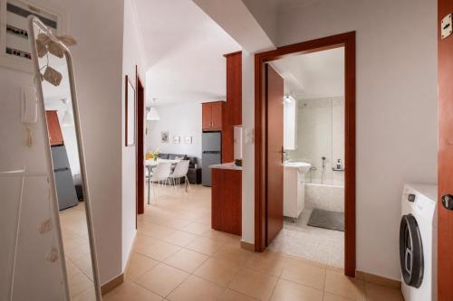 a hallway leading to a kitchen and a bathroom at Spartan Gem Apartment in Sparta