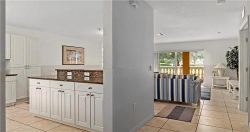 a kitchen with white cabinets and a counter top at Nature Lovers Paradise in Inverness