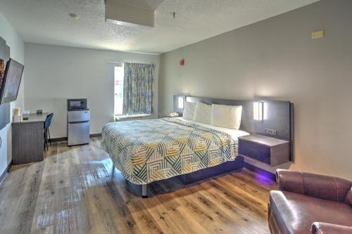 a hotel room with a bed and a couch at Motel 6-Libertyville, IL in Libertyville