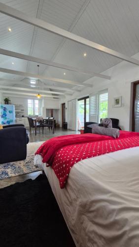 a bedroom with a large bed and a living room at 40 on Longmarket in Stanford