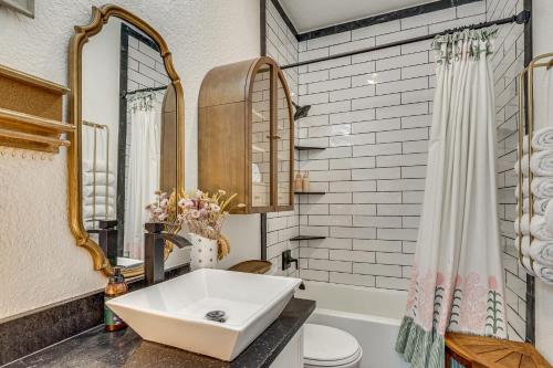 a bathroom with a sink and a tub and a mirror at < 1 Mi to Georgetown Square & SU! Extended Base in Georgetown