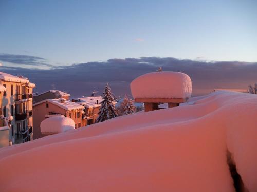 a view of a city covered in snow at Hotel Frizzolan in Bosco Chiesanuova