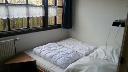 Llit o llits en una habitació de Julianadorp Direkt an den Dünen