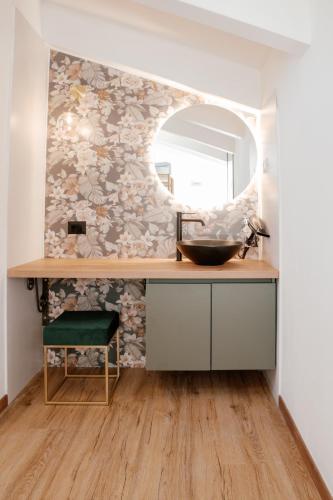 a bathroom with a sink and a mirror at Domo De Uccio in Alghero