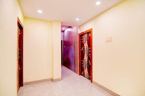 a hallway with two doors in a room at Hotel O New Star Guest House in Behāla