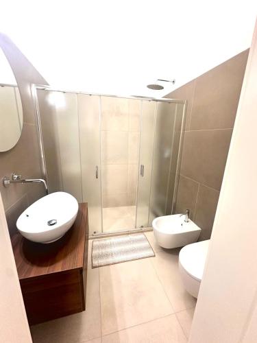 a bathroom with two sinks and a shower at A casa di Cetta in Melendugno