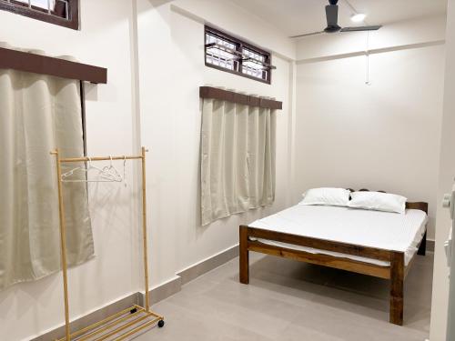 a bedroom with a bed and a window at LN Homes in Itānagar