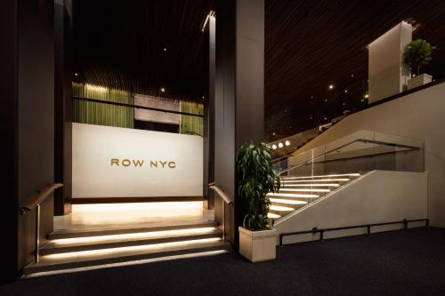 a set of stairs in a building with a now msg sign at ROW NYC at Times Square in New York
