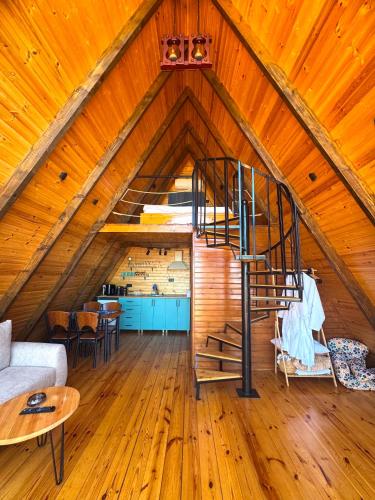 a room with a spiral staircase in a attic at Aleva in Gonio