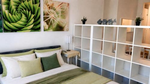 a bedroom with a bed and a bunch of bananas at Hotel Garden Flora Punta Cana Beach in Punta Cana