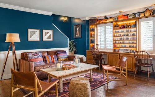 a living room with a couch and a table at Hotel Carmel in Carmel