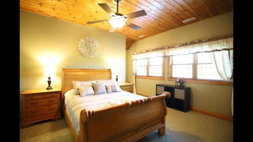 a bedroom with a bed and a ceiling fan at Welch View 68 Thornton Deluxe Private 4 Bedroom Home in Thornton