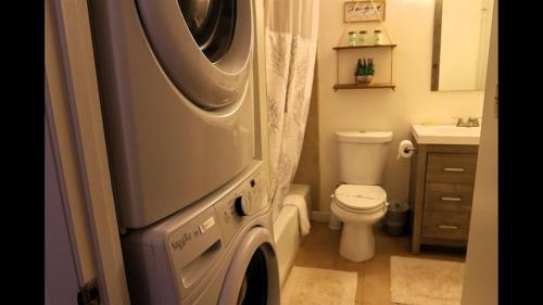 a washing machine in a bathroom with a toilet at Windsor Hill E53 WV Updated Pet Friendly Windsor Hill Condo in Waterville Valley