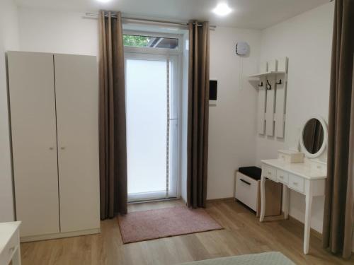 a bathroom with a large sliding glass door with a window at Happy Home1 in Cahul