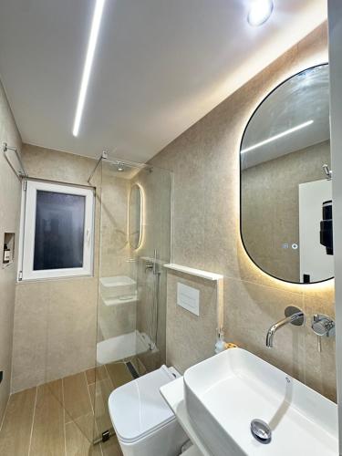 a bathroom with a sink and a mirror at Villa Ani in Borsh