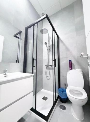 a bathroom with a shower and a toilet and a sink at Hostel LAS ROSAS in Madrid