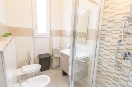 a bathroom with a toilet and a sink and a shower at Cittadella 5 in Florence