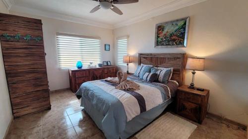 a bedroom with a bed and a ceiling fan at Casa Evita in Puerto Peñasco