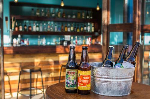 three bottles of beer in a bucket on a table at Hotel Festival Plaza Playas Rosarito in Rosarito