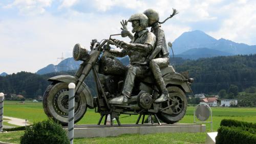 a statue of two men riding a motorcycle at Ferienwohnung Gästehaus Inge in Zlan