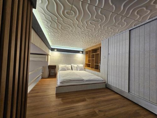 a bedroom with a bed in the middle of a room at Vision Luxury Apartment Rynek in Wrocław