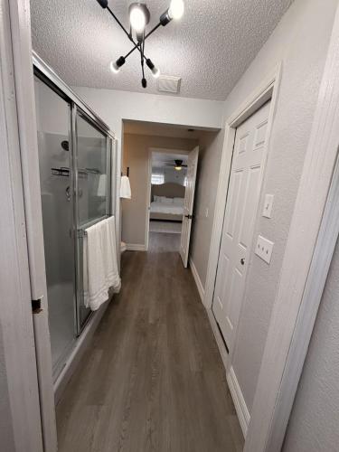 a hallway of a home with a ceiling fan at my place to be in Port Charlotte