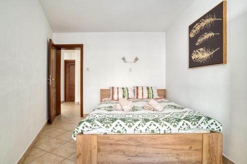 a bedroom with a wooden bed in a room at Historic Old Town Kotor in Kotor