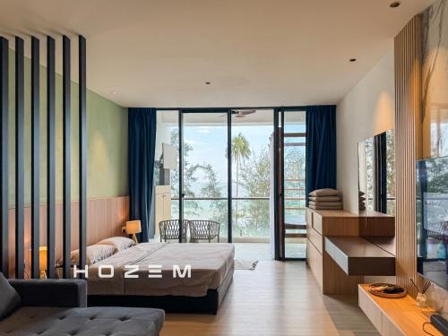 a bedroom with a bed and a large window at SB1B4P Hozem SA B46 Roxy Sematan in Sematan