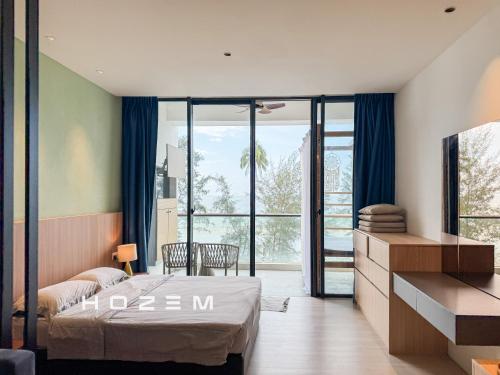 a bedroom with a bed and a large window at SB1B4P Hozem SA B46 Roxy Sematan in Sematan