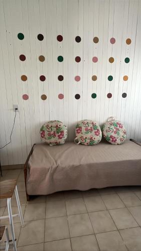 a bedroom with a bed with polka dots on the wall at la casita del altillo in San Francisco