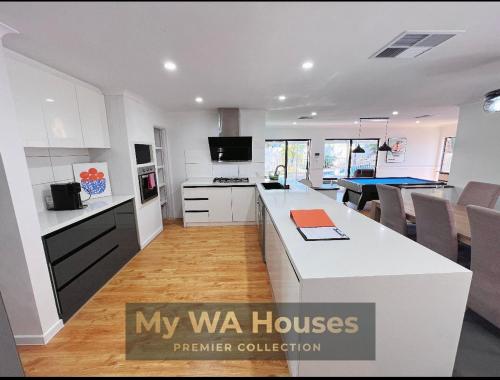a kitchen with a large white counter top in a room at Edgewater Whole Holiday Resort in Perth