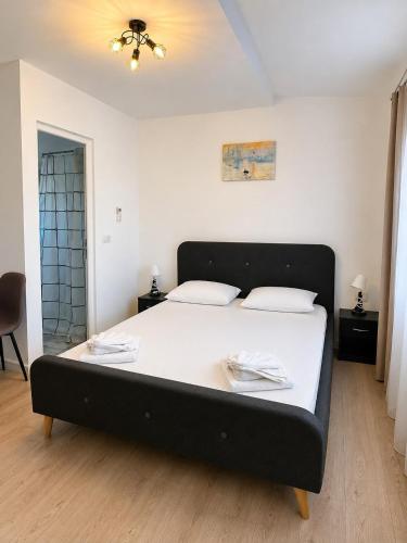 a bedroom with a large bed in a room at Paradox Cantacuzino in Eforie Sud