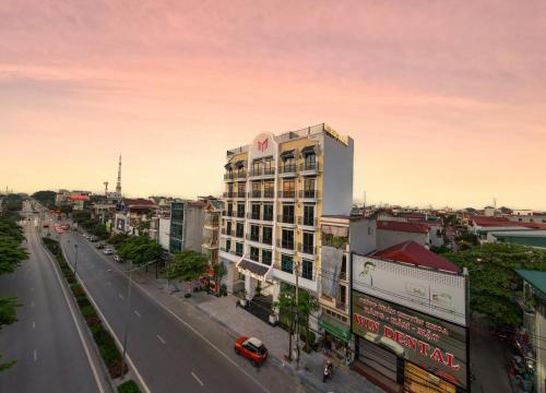 a view of a city street with a building at MT Collection Legacy Hotel Ninh Binh - Near Hoa Lu Ancient Town with Rooftop Pool in Ninh Binh