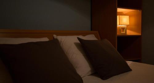 Ένα ή περισσότερα κρεβάτια σε δωμάτιο στο Apartments MT Residence