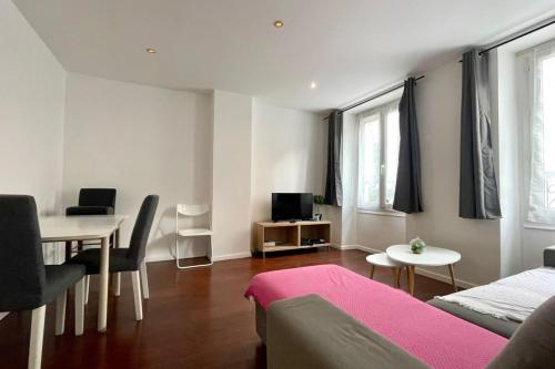 a living room with a couch and a table at 35 min from Paris - Saint Maurice - Chez Nolan in Saint-Maurice