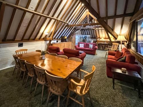 a large room with a wooden table and chairs at Granary - Uk51016 in Louth